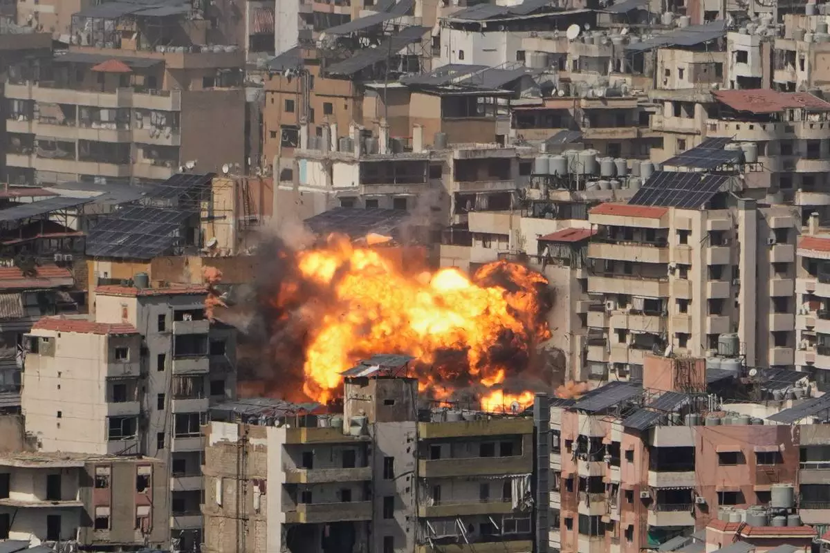 Flames rise from an Israeli airstrike in Dahiyeh, Beirut's southern suburbs, Wednesday, March 11, 2026. (AP Photo/Hassan Ammar)