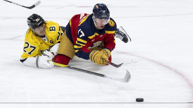 Florida Panthers center Evan Rodrigues (17) and Boston Bruins defenseman Hampus Lindholm (27) compete for the puck in the second period of their NHL game at the Amerant Bank Arena on Wednesday, Feb. 4, 2026, in Sunrise, Fla. Florida Panthers center Evan Rodrigues (17) and Boston Bruins defenseman Hampus Lindholm (27) compete for the puck in the second period of their NHL game at the Amerant Bank Arena on Wednesday, Feb. 4, 2026, in Sunrise, Fla.
