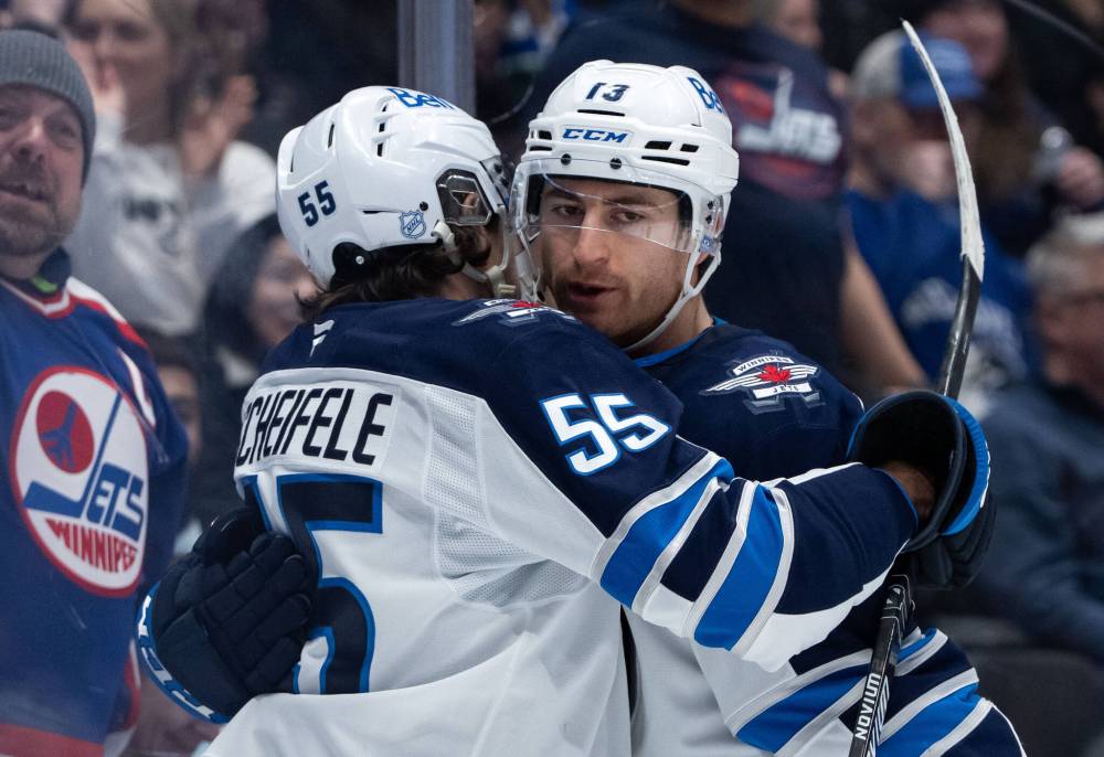 ETHAN CAIRNS / THE CANADIAN PRESS FILES
Winnipeg Jets forward Gabriel Vilardi (right) is having a banner year with the club. Going into Thursday night’s action against the Colorado Avalanche — his career-high 72nd game in a single regular season — the forward had already tied last season’s career-high goal record (27) and sat two points back of tying his career-high 61 points record.