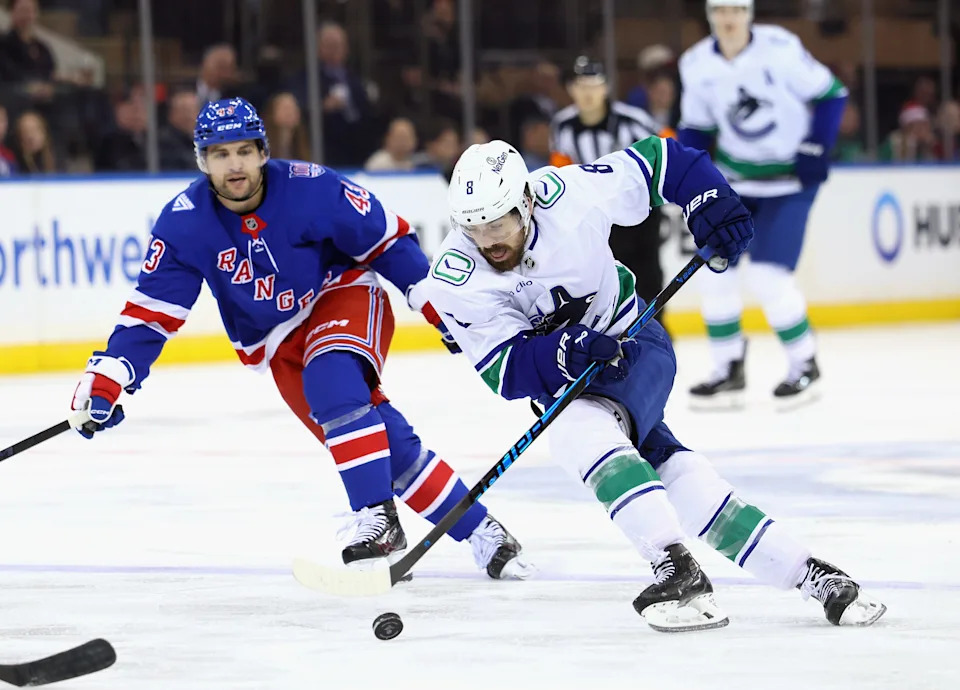 NEW YORK, NEW YORK - DECEMBER 16: Conor Garland #8 of the Vancouver Canucks carries the puck against the New York Rangers during the third period at Madison Square Garden on December 16, 2025 in New York City. The Canucks shut out the Rangers 3-0. (Photo by Bruce Bennett/Getty Images)
