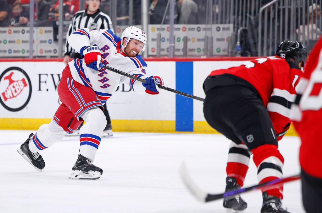 Vladislav Gavrikov #44 of the New York Rangers scoring a goal against the New Jersey Devils.