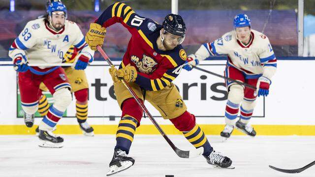 Florida Panthers left wing A.J. Greer (10) skates with the puck in the third period of his Winter Classic outdoor hockey game against the New York Rangers at loanDepot park on Friday, Jan. 2, 2026, in Miami, Fla.