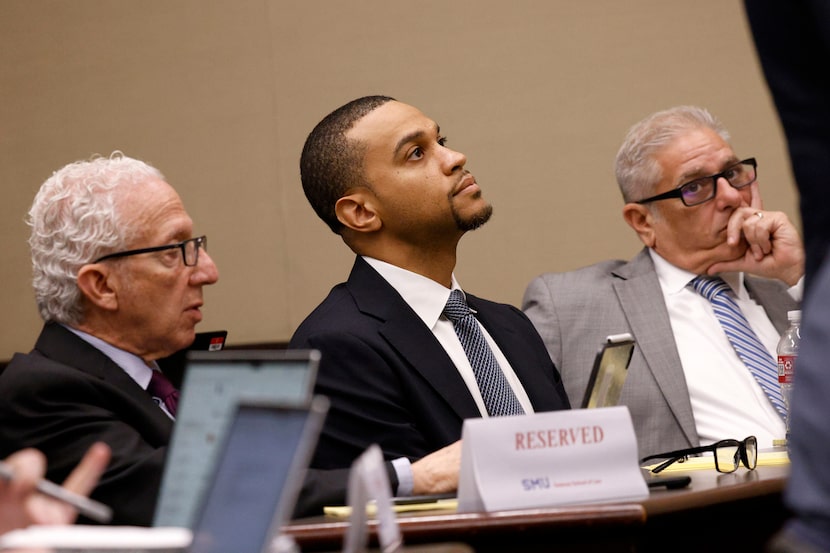 Sekou Lewis, the Dallas Mavericks general counsel and chief ethics officer, center, is seen...