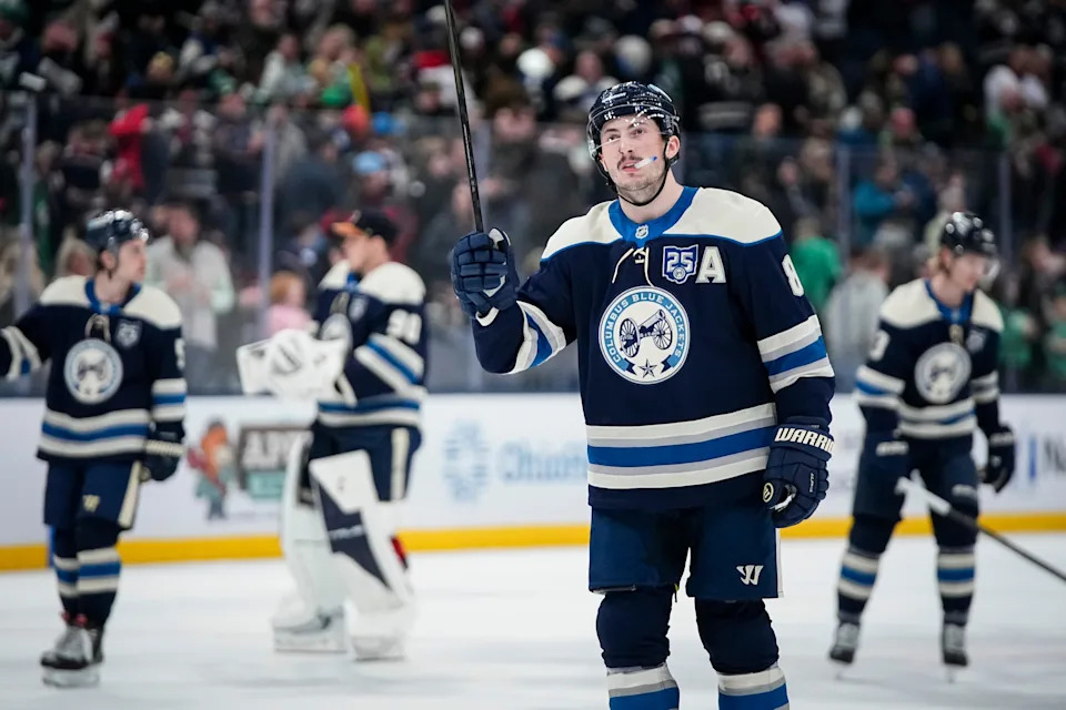 Blue Jackets defenseman Zach Werenski salutes fans following a win over the Hurricanes on March 17.