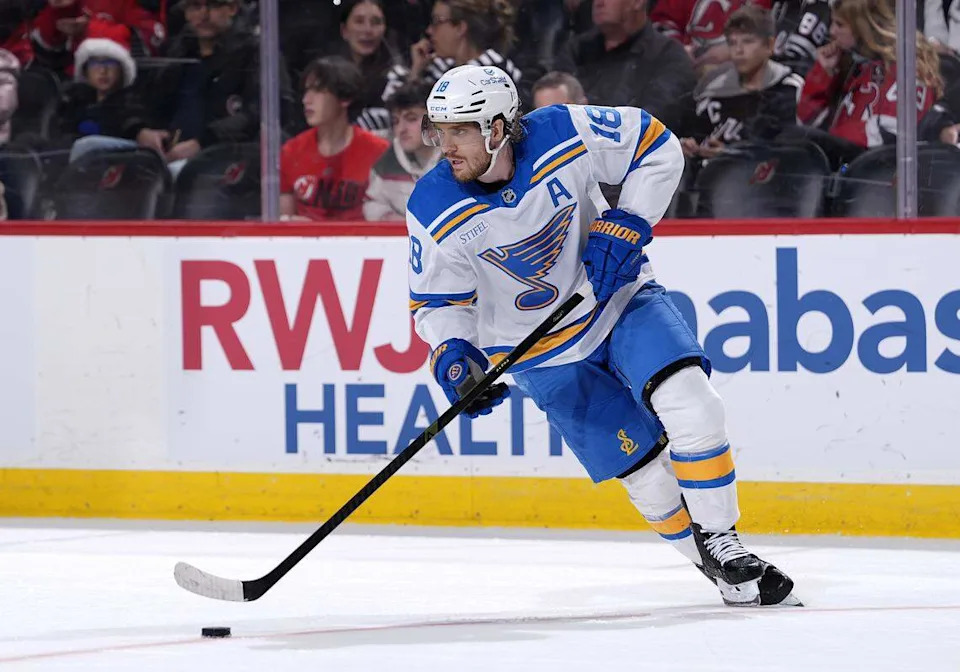 Robert Thomas of the St. Louis Blues controls the puck during overtime against the New Jersey Devils at Prudential Center on Nov. 26, 2025 in Newark, New Jersey.
