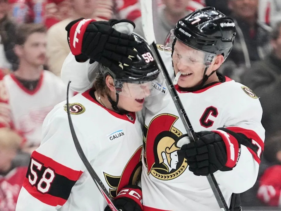  Ottawa Senators forward Brady Tkachuk (right) celebrates his first-period goal with teammate Carter Yakemchuk during their team’s game against the Detroit Red Wings on March 24, 2026, in Detroit.