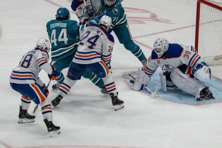 Feb 28, 2026; San Jose, California, USA; Edmonton Oilers goaltender Connor Ingram (39) makes a save against San Jose Sharks left wing Kiefer Sherwood (44) during the third period at SAP Center at San Jose.