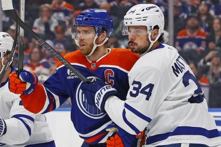 Feb 3, 2026; Edmonton, Alberta, CAN; Edmonton Oilers forward Connor McDavid (97) and Toronto Maple Leafs forward Auston Matthews (34) battle for position during the first period at Rogers Place. Mandatory Credit: Perry Nelson-Imagn Images