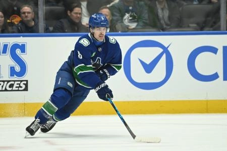 Feb 25, 2026; Vancouver, British Columbia, CAN; Vancouver Canucks right wing Conor Garland (8) skates with the puck during the third period against the Winnipeg Jets at Rogers Arena.