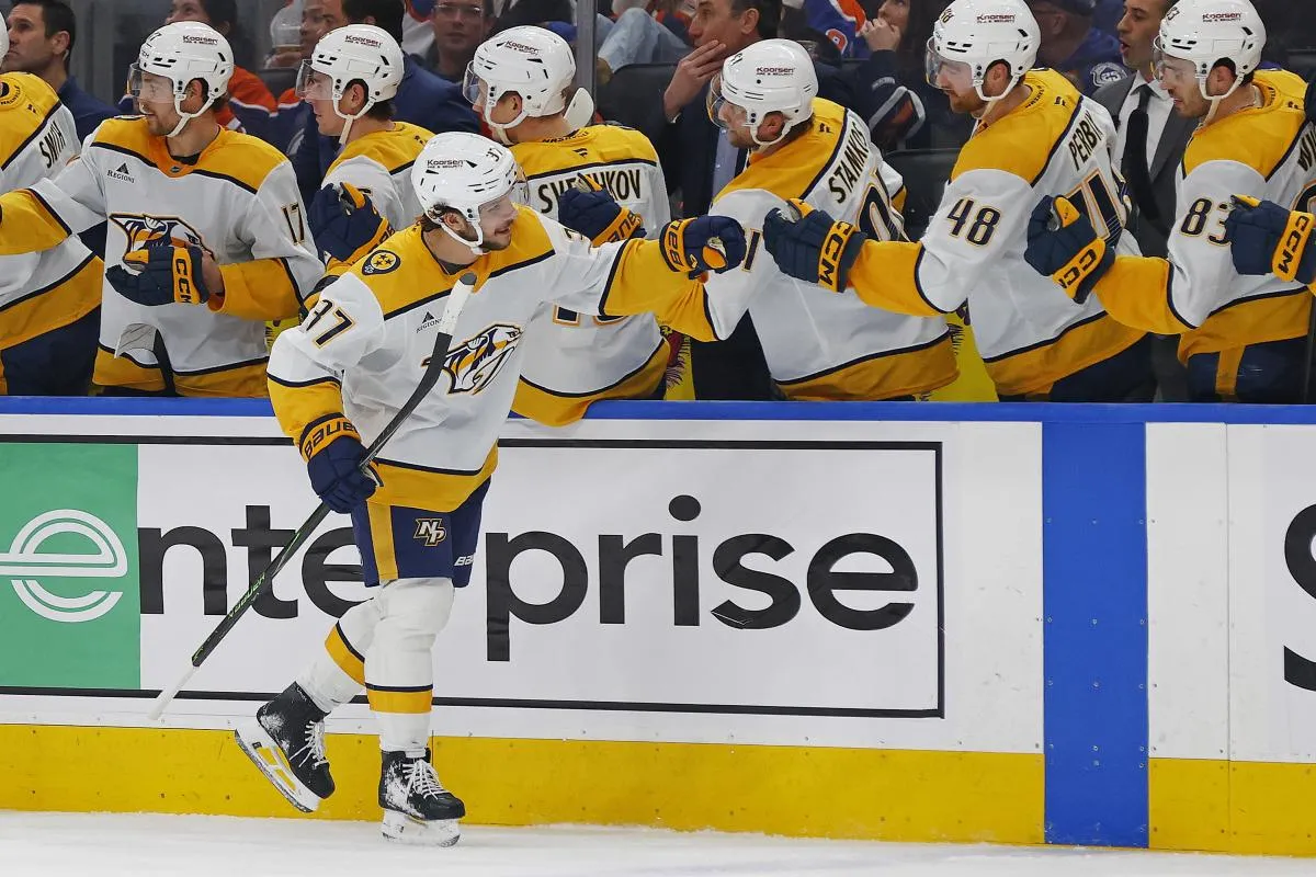 The Nashville Predators celebrate a goal scored by defensemen Nick Blankenburg (37) during the third period against the Edmonton Oilers at Rogers Place.