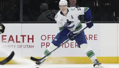 Vancouver Canucks defenseman Tyler Myers (57) looks for a play against the Utah Mammoth during the third period at Delta Center.