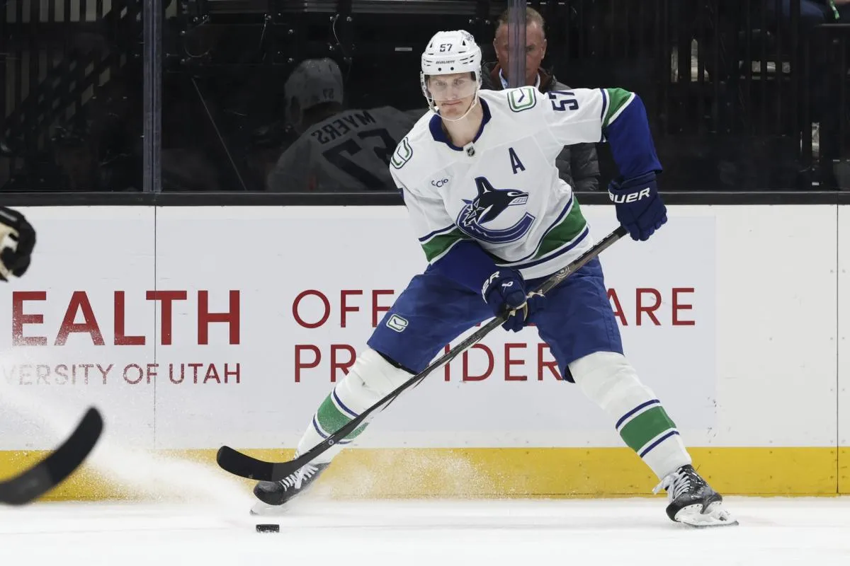 Vancouver Canucks defenseman Tyler Myers (57) looks for a play against the Utah Mammoth during the third period at Delta Center.