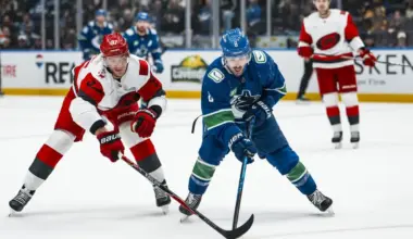 Carolina Hurricanes forward Andrei Svechnikov (37) stick checks Vancouver Canucks forward Conor Garland (8) in the third period at Rogers Arena.