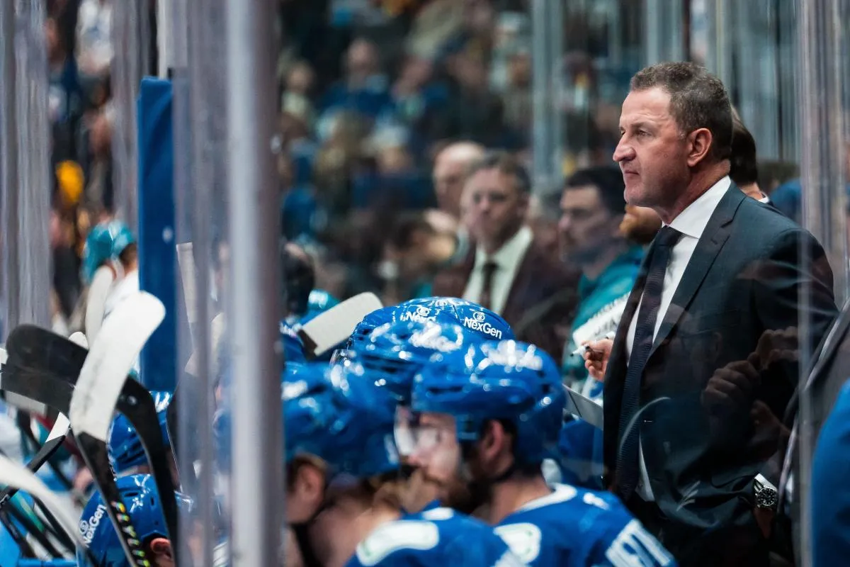 Vancouver Canucks head coach Adam Foote on the bench against the San Jose Sharks in the third period at Rogers Arena.