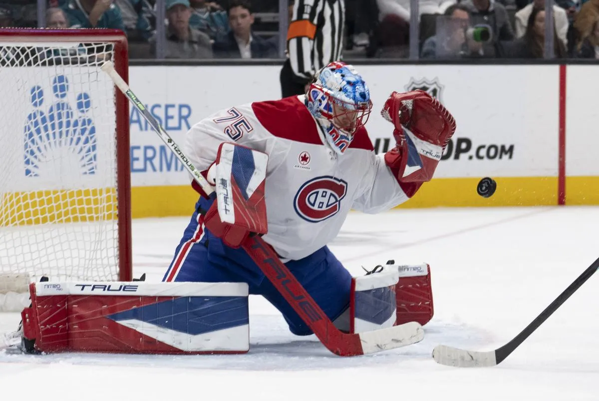 Montreal Canadiens goaltender Jakub Dobes (75) defends the goal during the second period against the San Jose Sharks at SAP Center at San Jose.