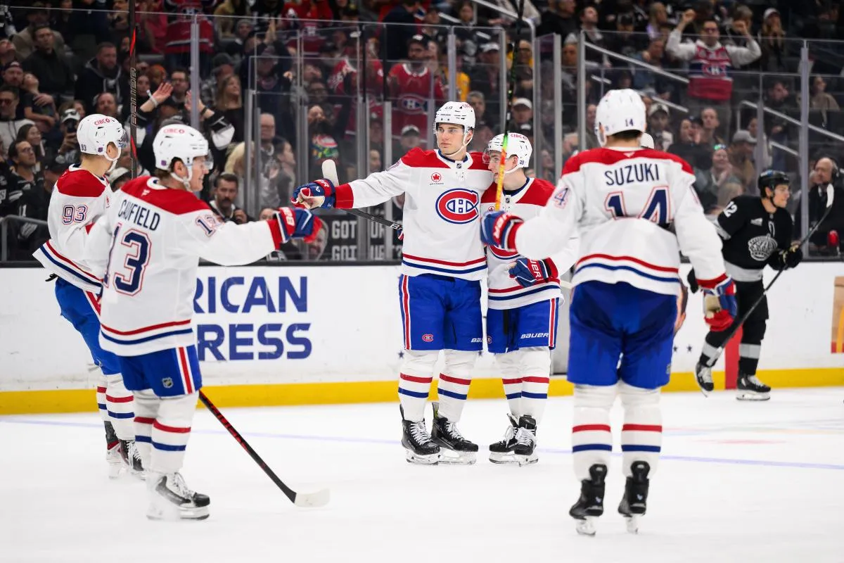 Montr&eacute;al Canadiens left wing Juraj Slafkovsk&yacute; (20) is greeted by teammates after scoring during the third period against the Los Angeles Kings at Crypto.com Arena.
