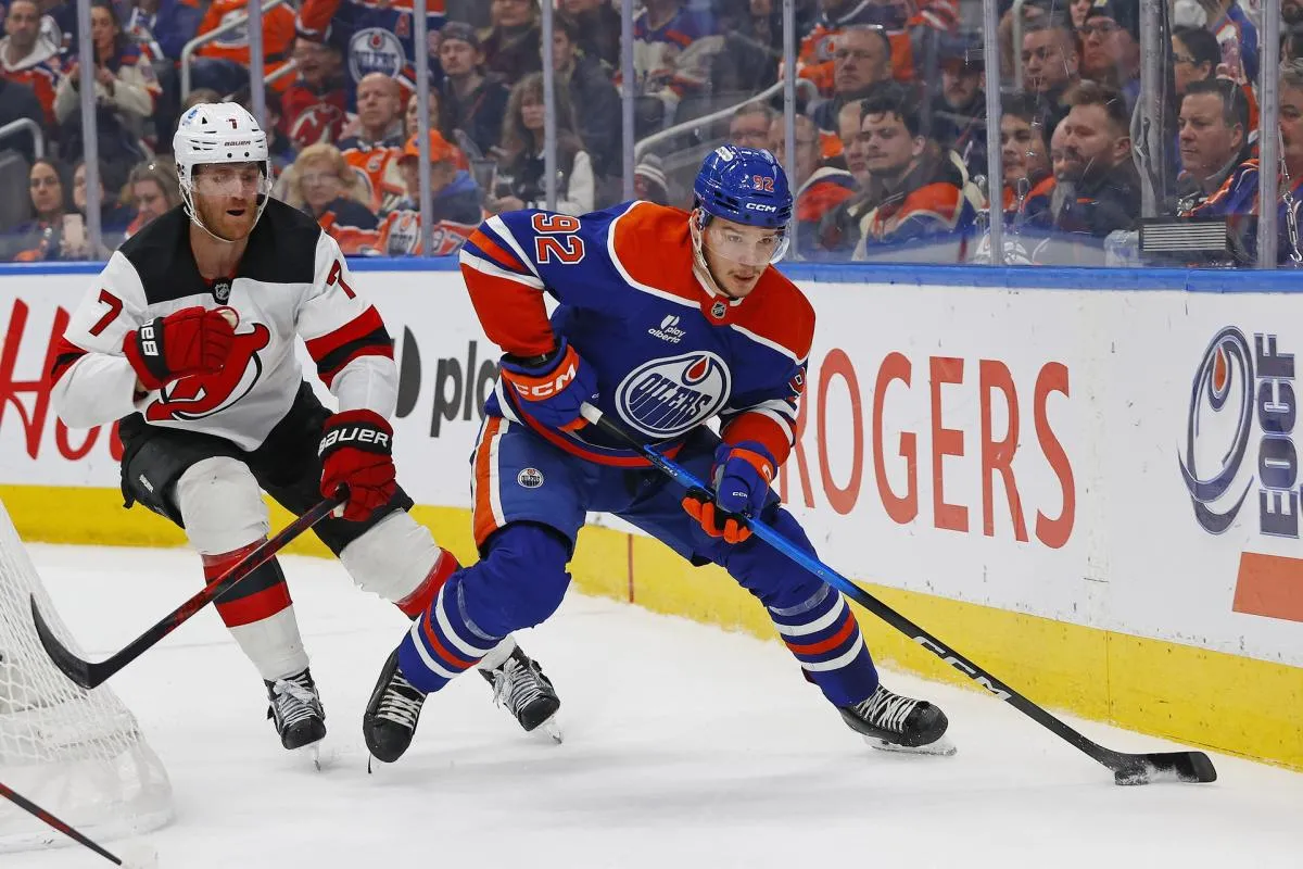 Edmonton Oilers forward Vasily Podkolzin (92) looks to make a pass in front of New Jersey Devils defensemen Dougie Hamilton (7) during the third period at Rogers Place.