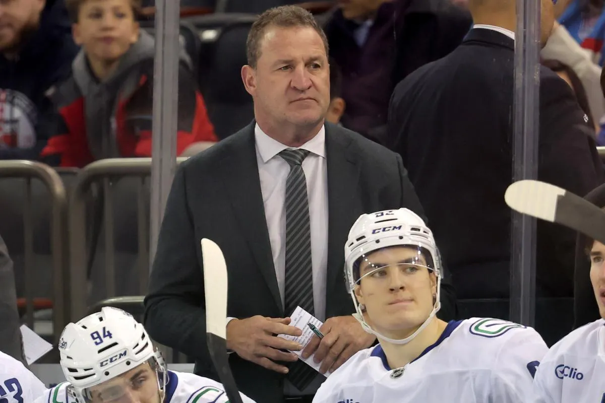 Vancouver Canucks head coach Adam Foote coaches against the New York Rangers during the first period at Madison Square Garden.