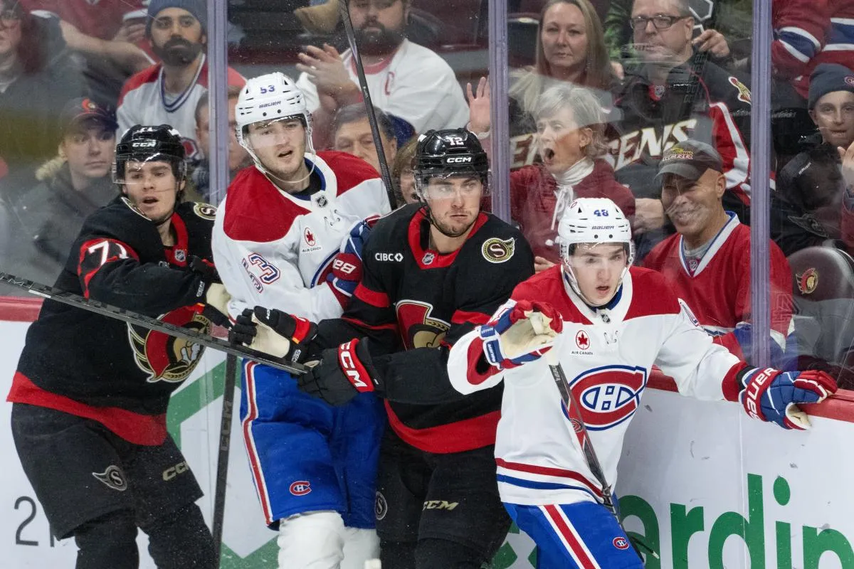 Ottawa Senators centers Ridly Greig (71) and Shane Pinto (12) follow the puck after battling with Montreal Canadiens defensemen Noah Dobson (53) and Lane Hutson (48) in the third period at the Canadian Tire Centre.