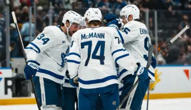 Toronto Maple Leafs forward Auston Matthews (34) and defenseman Troy Stecher (28) and forward Max Domi (11) and defenseman Oliver Ekman-Larsson (95) and forward Bobby McMann (74) celebrate Domi