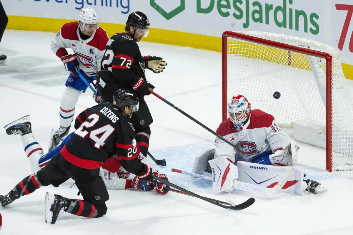 Montreal Canadiens goalie Jacob Fowler (32) makes a save in front of Ottawa Senators center Dylan Cozens (24) in the third period at the Canadian Tire Centre.