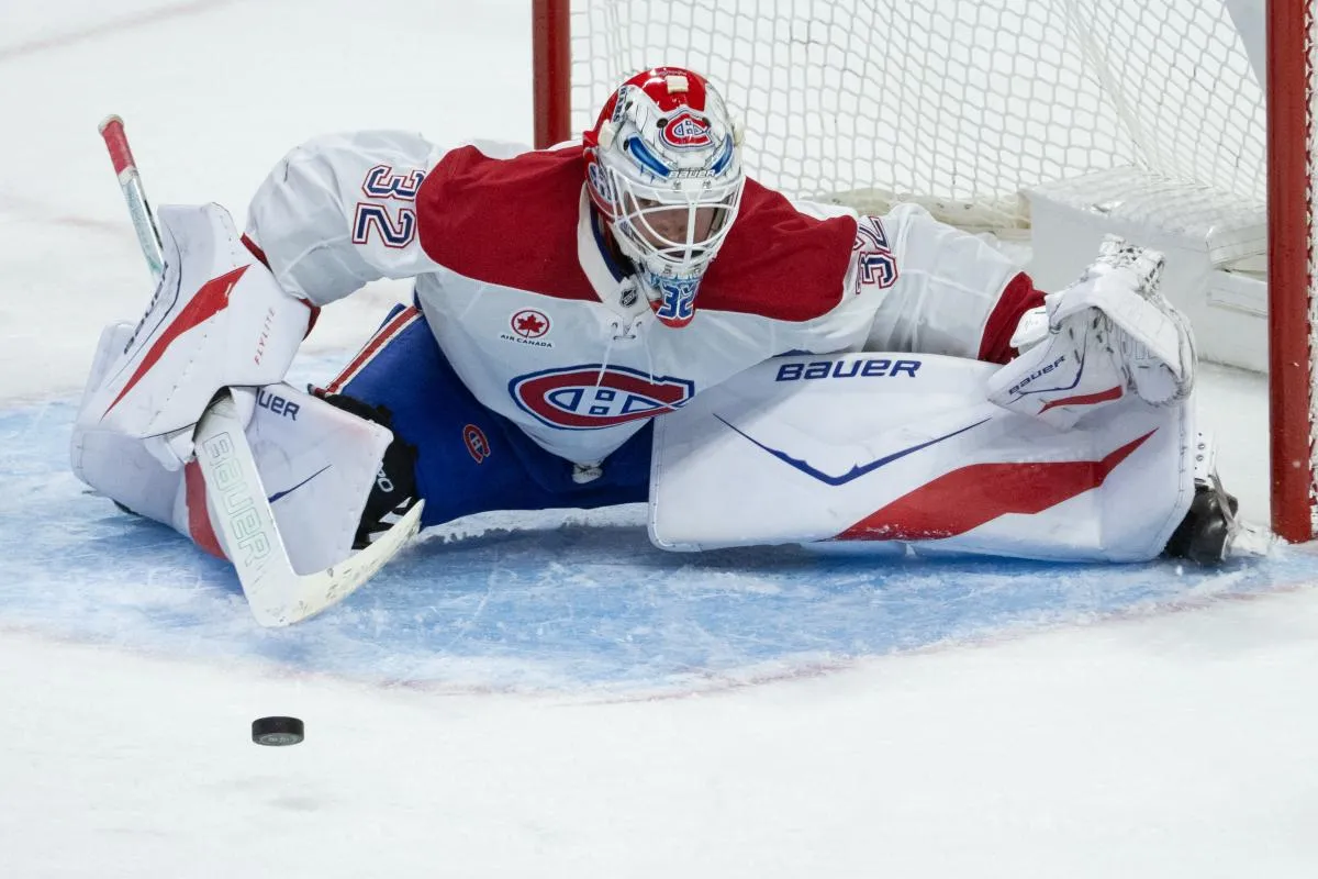 Montreal Canadiens goalie Jacob Fowler (32) makes a save in the third period against the Ottawa Senators at the Canadian Tire Centre.