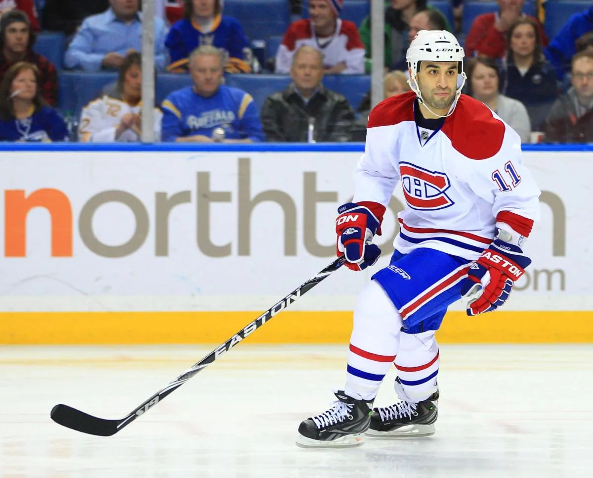 Montreal Canadiens center Scott Gomez (11) during play in the game against the Buffalo Sabres at the First Niagara Center. The Canadiens beat the Sabres 4-3 in a shootout.