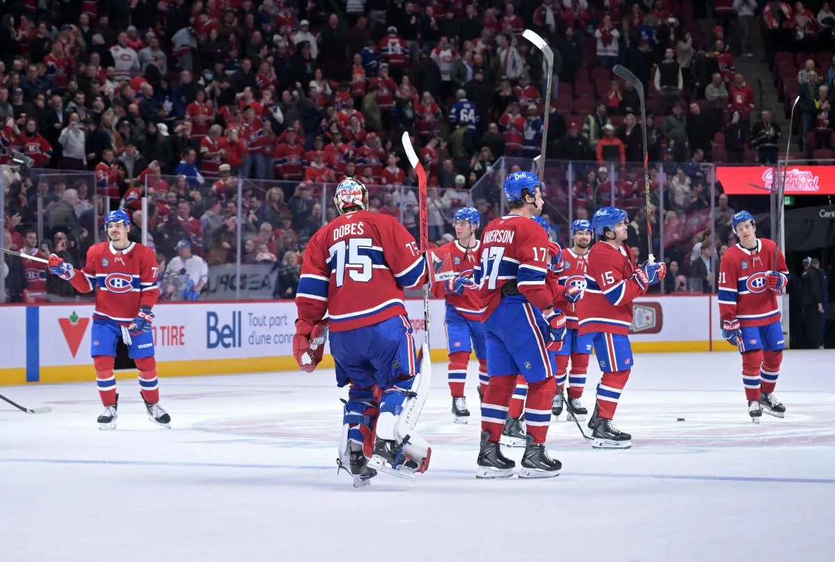 Montreal Canadiens goalie Jakub Dobes (75) celebrates with teammates after defeating the Toronto Maple Leafs in the third period at the Bell Centre.
