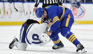 Buffalo Sabres defenseman Luke Schenn (5) and Toronto Maple Leafs center Dakota Joshua (81) fight during the first period at KeyBank Center.