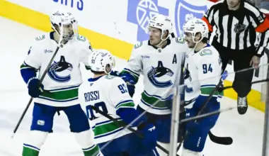 Vancouver Canucks right wing Brock Boeser (6), second from right, celebrates with teammates after scoring a goal against the Chicago Blackhawks during the third period at United Center.