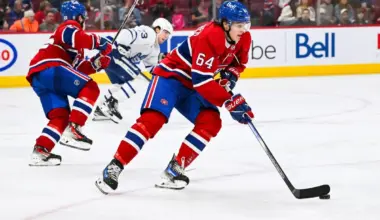 Montreal Canadiens defenseman David Reinbacher (64) plays the puck against the Toronto Maple Leafs during the third period at Bell Centre.