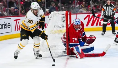 Boston Bruins right wing David Pastrnak (88) plays the puck against Montreal Canadiens goalie Jakub Dobes (75) during the third period at Bell Centre.