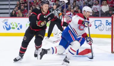 Ottawa Senators left wing Brady Tkachuk (7) and Montreal Canadiens defenseman Mike Matheson (8) chase the puck in the first period at the Canadian Tire Centre.