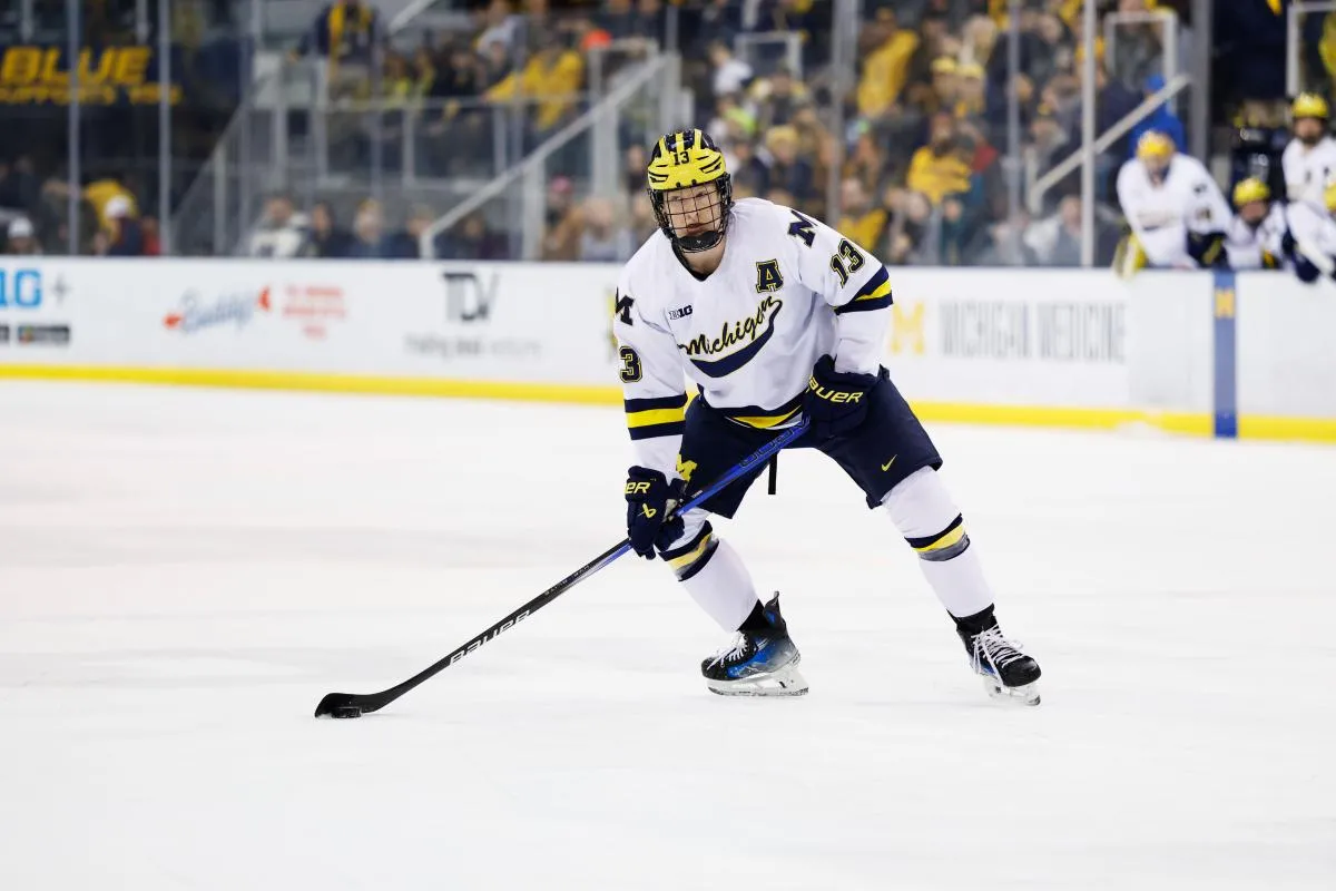 Michigan Wolverines forward T.J. Hughes (13) skates against Penn State during a Big Ten Tournament quarter final game at Yost Arena.