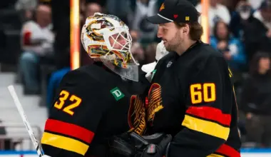 Vancouver Canucks goalie Kevin Lankinen (32) and goalie Nikita Tolopilo (60) celebrate their victory against the Florida Panthers at Rogers Arena.