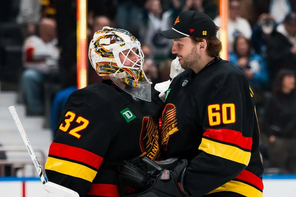Vancouver Canucks goalie Kevin Lankinen (32) and goalie Nikita Tolopilo (60) celebrate their victory against the Florida Panthers at Rogers Arena.