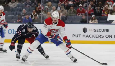 Montreal Canadiens defenseman Arber Xhekaj (72) controls the puck as Columbus Blue Jackets left wing Miles Wood (11) trails the play during the second period at Nationwide Arena.