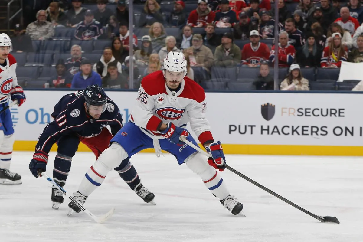 Montreal Canadiens defenseman Arber Xhekaj (72) controls the puck as Columbus Blue Jackets left wing Miles Wood (11) trails the play during the second period at Nationwide Arena.