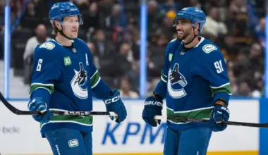 Vancouver Canucks forward Brock Boeser (6) and forward Evander Kane (91) share a smile during a stop in play against the Anaheim Ducks in the second period at Rogers Arena.
