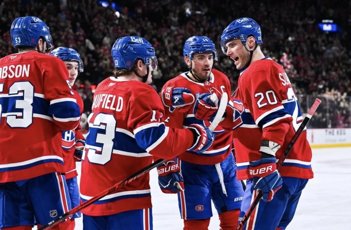 Montreal Canadiens left wing Juraj Slafkovsky (20) celebrates with his teammates his second goal of the game against the New York Islanders during the third period at Bell Centre.
