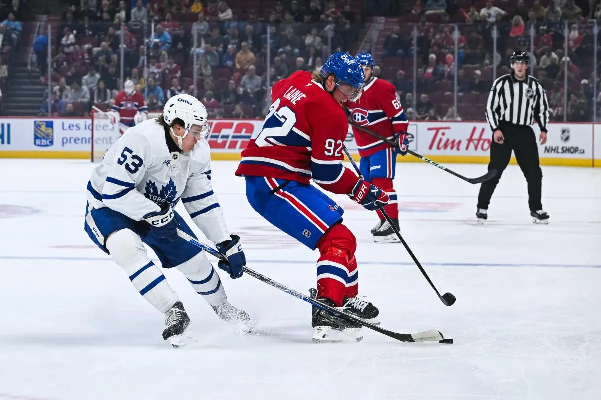 Toronto Maple Leafs forward Easton Cowan (53) defends the puck against Montreal Canadiens right wing Patrik Laine (92) during the first period at Bell Centre.