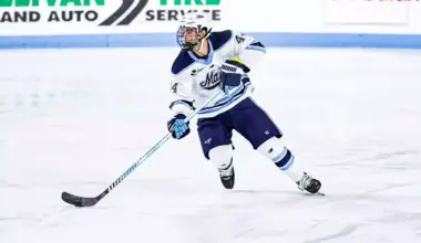 University of Maine defenceman Frank Djurasevic skates with the puck during an NCAA game.