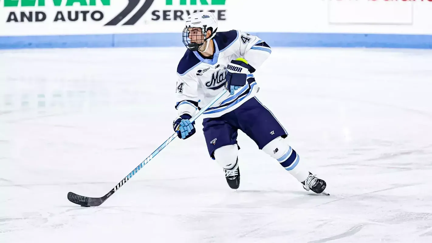 University of Maine defenceman Frank Djurasevic skates with the puck during an NCAA game.