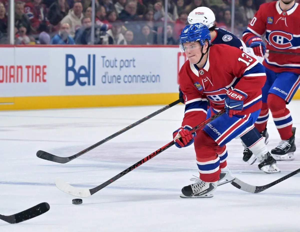 Montreal Canadiens forward Cole Caufield (13) plays the puck during the second period of the game against the Columbus Blue Jackets at the Bell Centre.