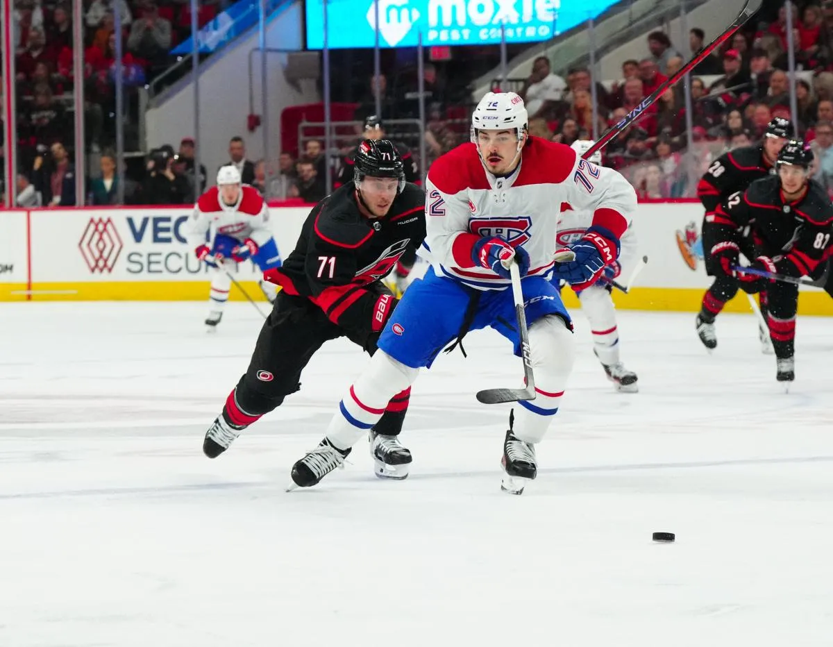 Montreal Canadiens defenseman Arber Xhekaj (72) and Carolina Hurricanes right wing Jesper Fast (71) chase AFTER THE PCUK D1P at PNC Arena.
