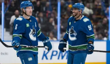 Vancouver Canucks forward Brock Boeser (6) and forward Evander Kane (91) share a smile during a stop in play against the Anaheim Ducks in the second period at Rogers Arena.