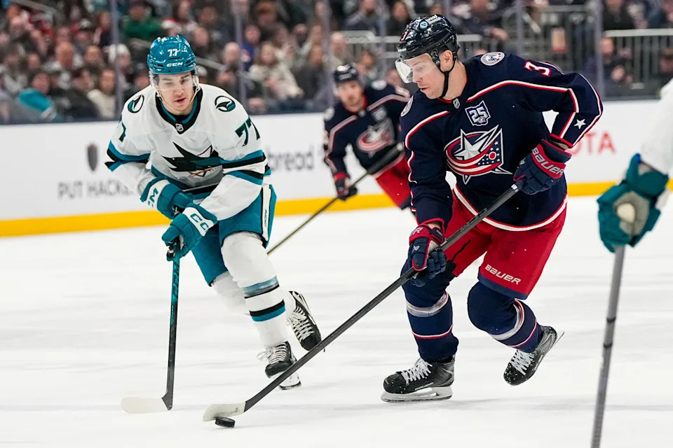 Columbus Blue Jackets center Charlie Coyle (3) skates with the puck against San Jose Sharks center Michael Misa (77) in the first period of the NHL game at Nationwide Arena on Saturday, March 28, 2026 in Columbus, Ohio.