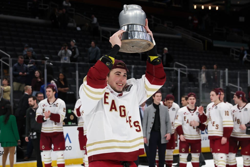 Drew Fortescue of the Boston College Eagles skates with the Beanpot following their 6-2 win against the Boston University Terriers. Getty Images