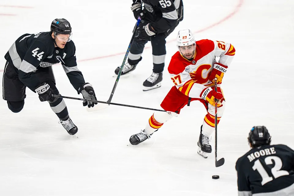 Calgary Flames right wing Matt Coronato (27) surrounded by Kings during an NHL hockey game against the Los Angeles Kings on February 26th, 2026 in Los Angeles, CA.