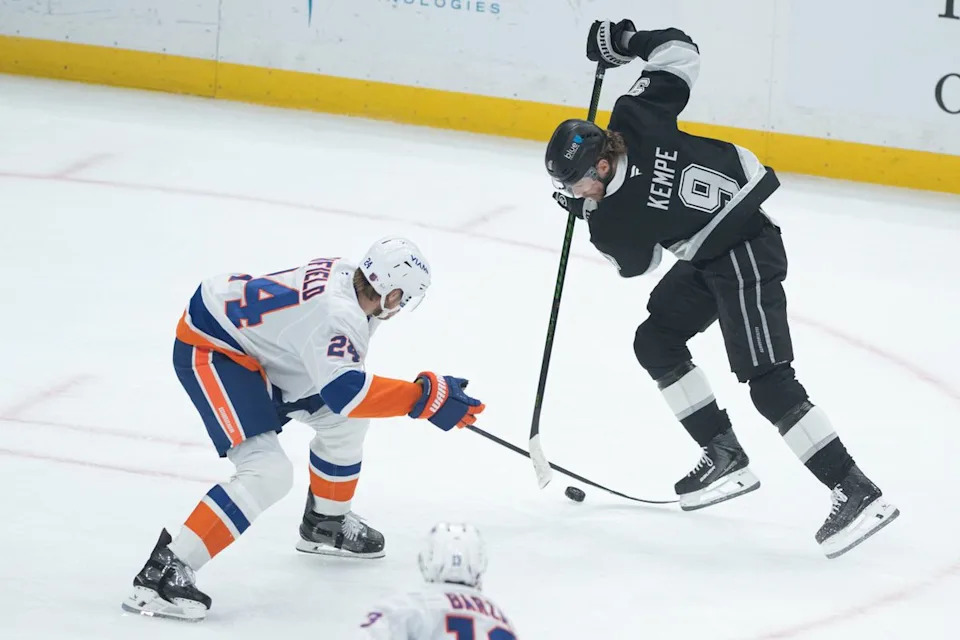 LA Kings right wing Adrian Kempe (9) battles for the puck during an NHL game between the New York Islanders and the Los Angeles Kings on Thursday, March 5, 2026 at Crypto.com Arena in Los Angeles Calif